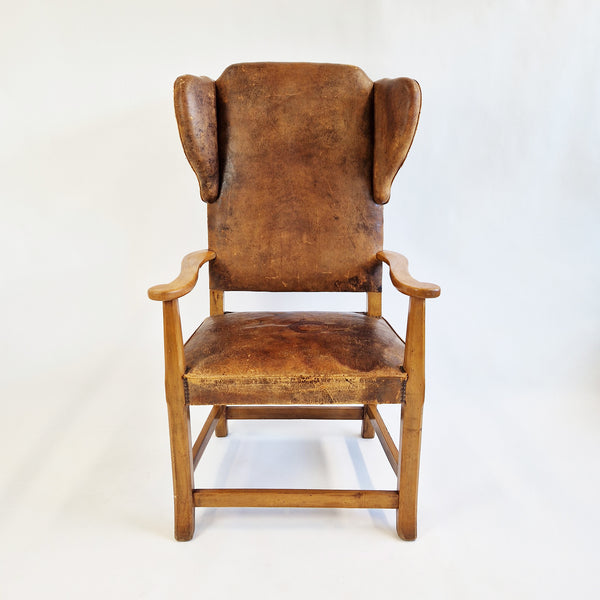 Mid-century Italian leather wingbacked armchair