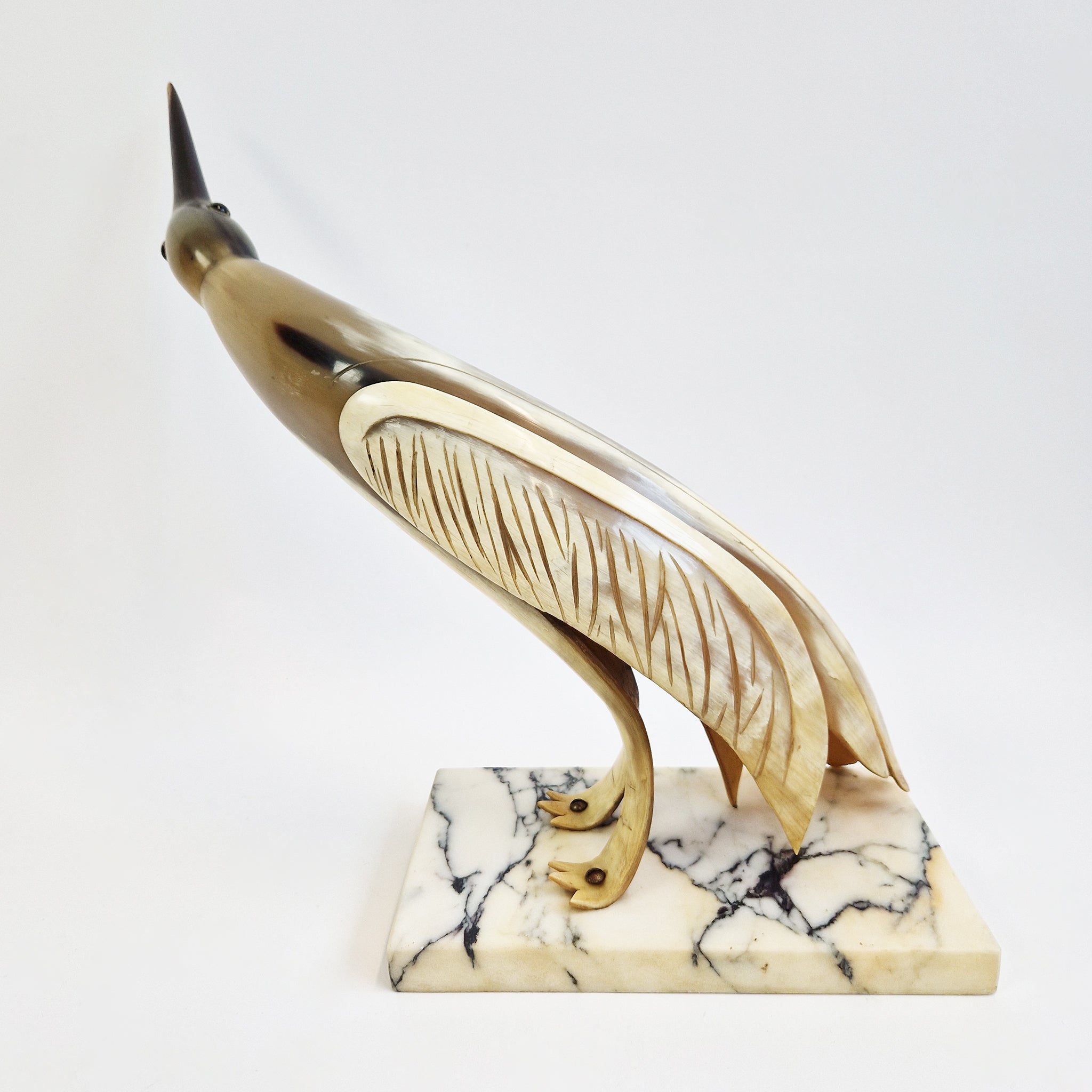 Mid-century horn bird statue on marble base