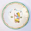 Vintage hand-painted wall plate with peasant woman