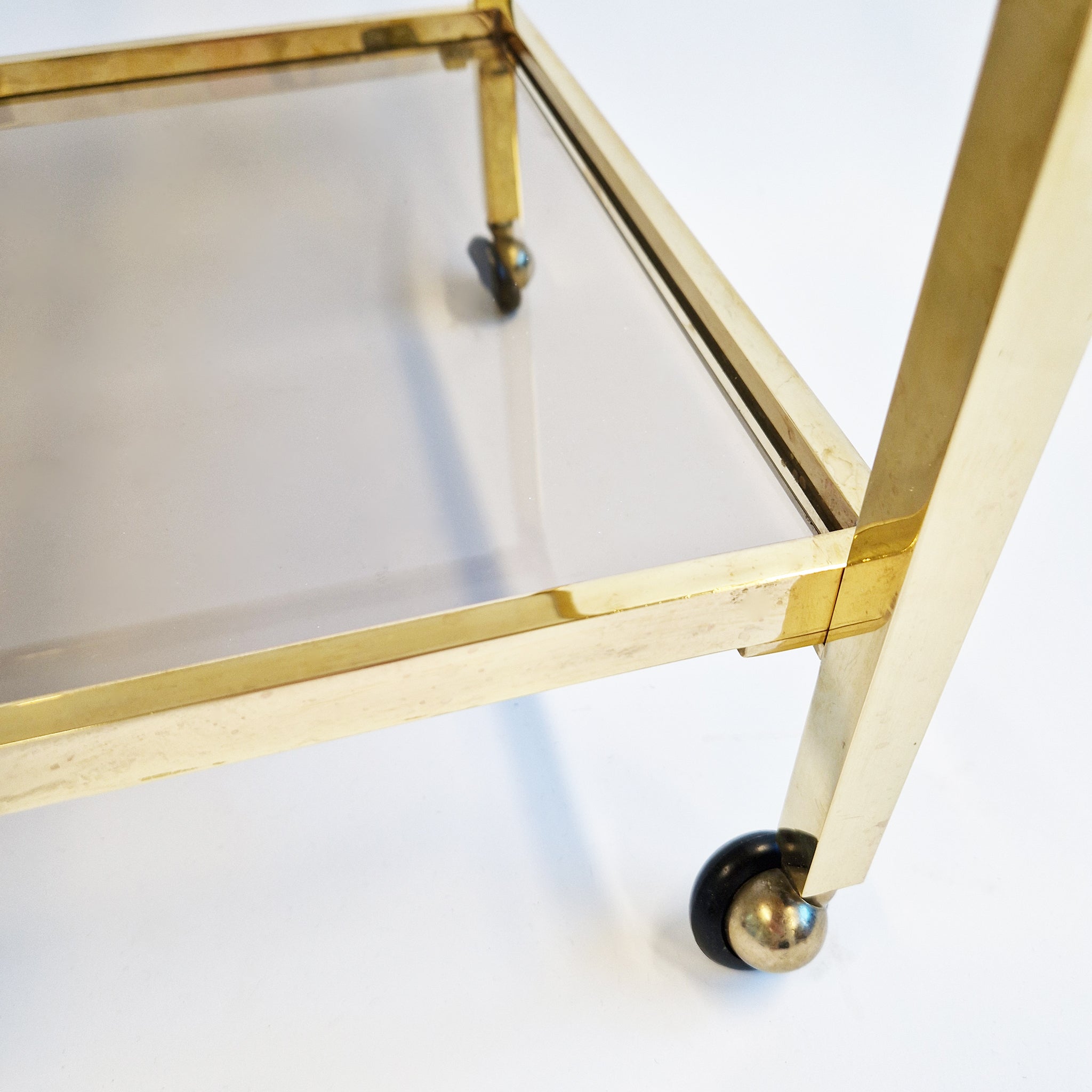 Vintage Italian brass side table on wheels