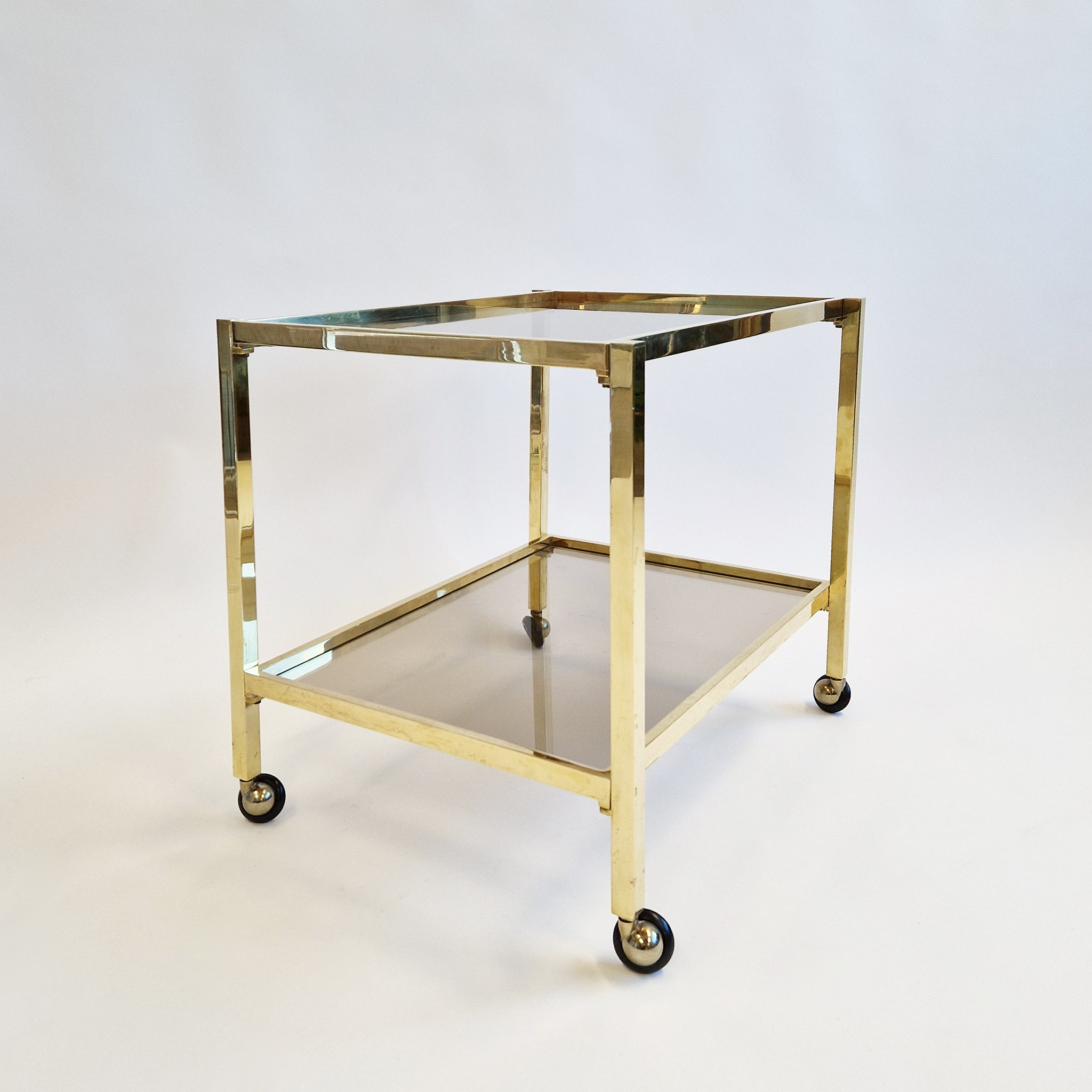 Vintage Italian brass side table on wheels