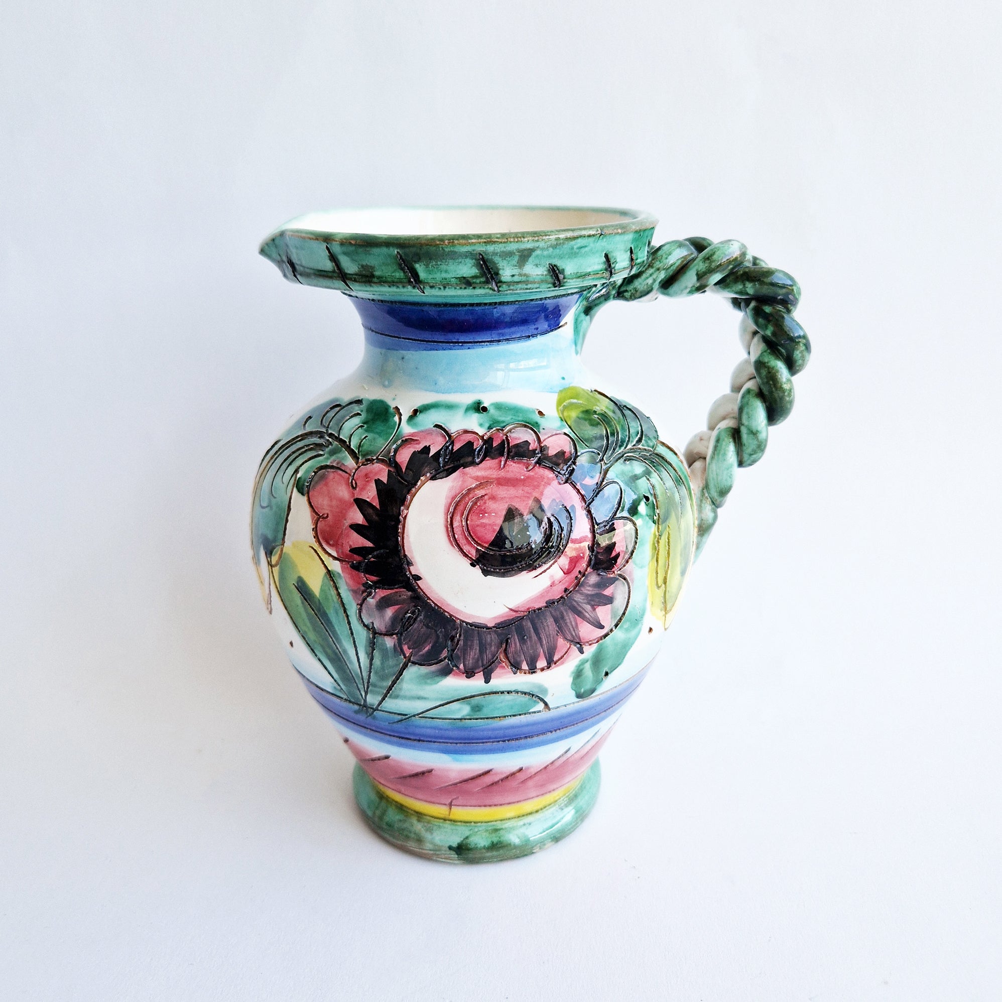 Vintage Italian maiolica jug with braided handle