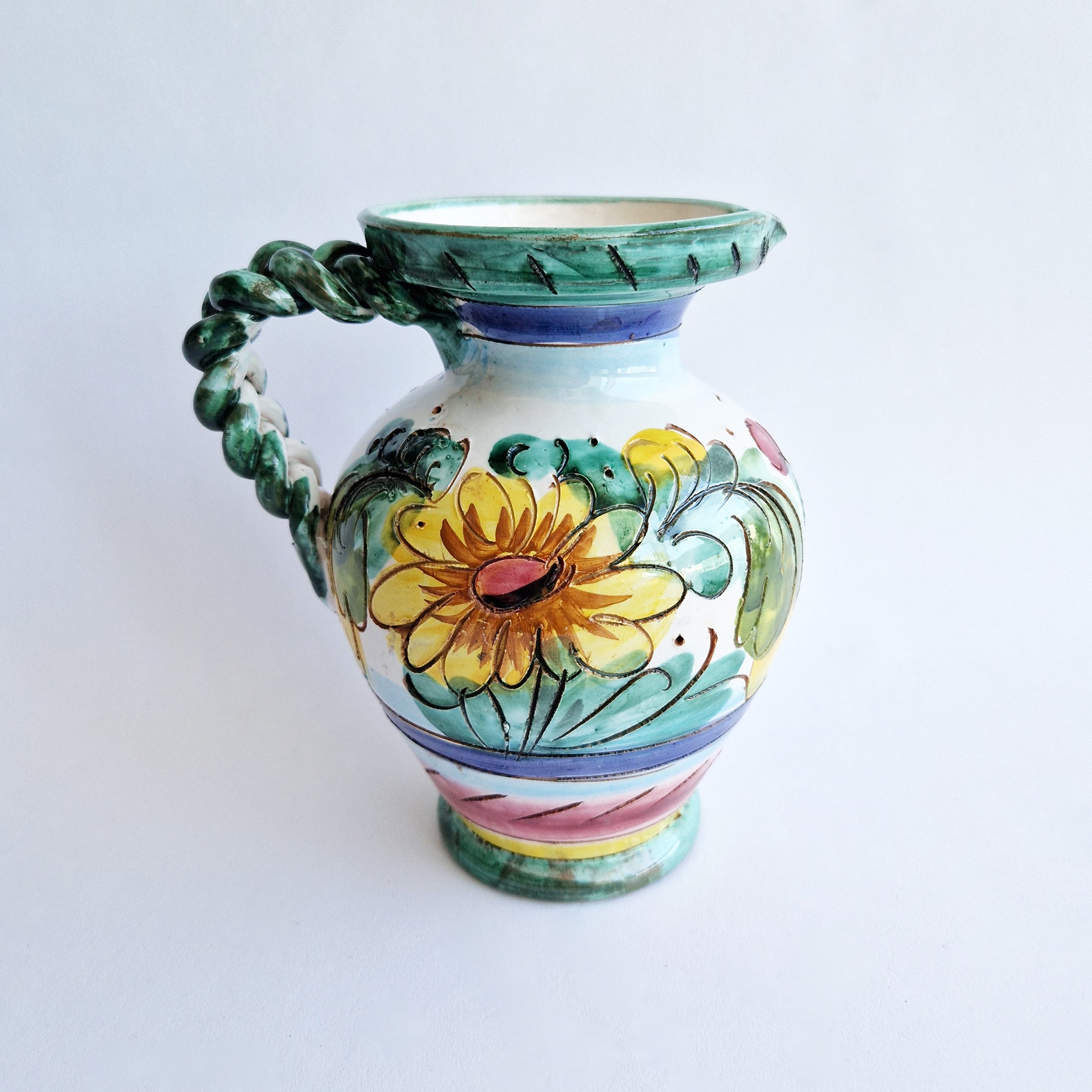 Vintage Italian maiolica jug with braided handle