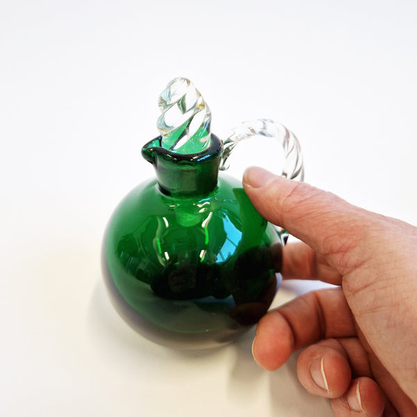 Hand-blown vintage green glass cruet bottle