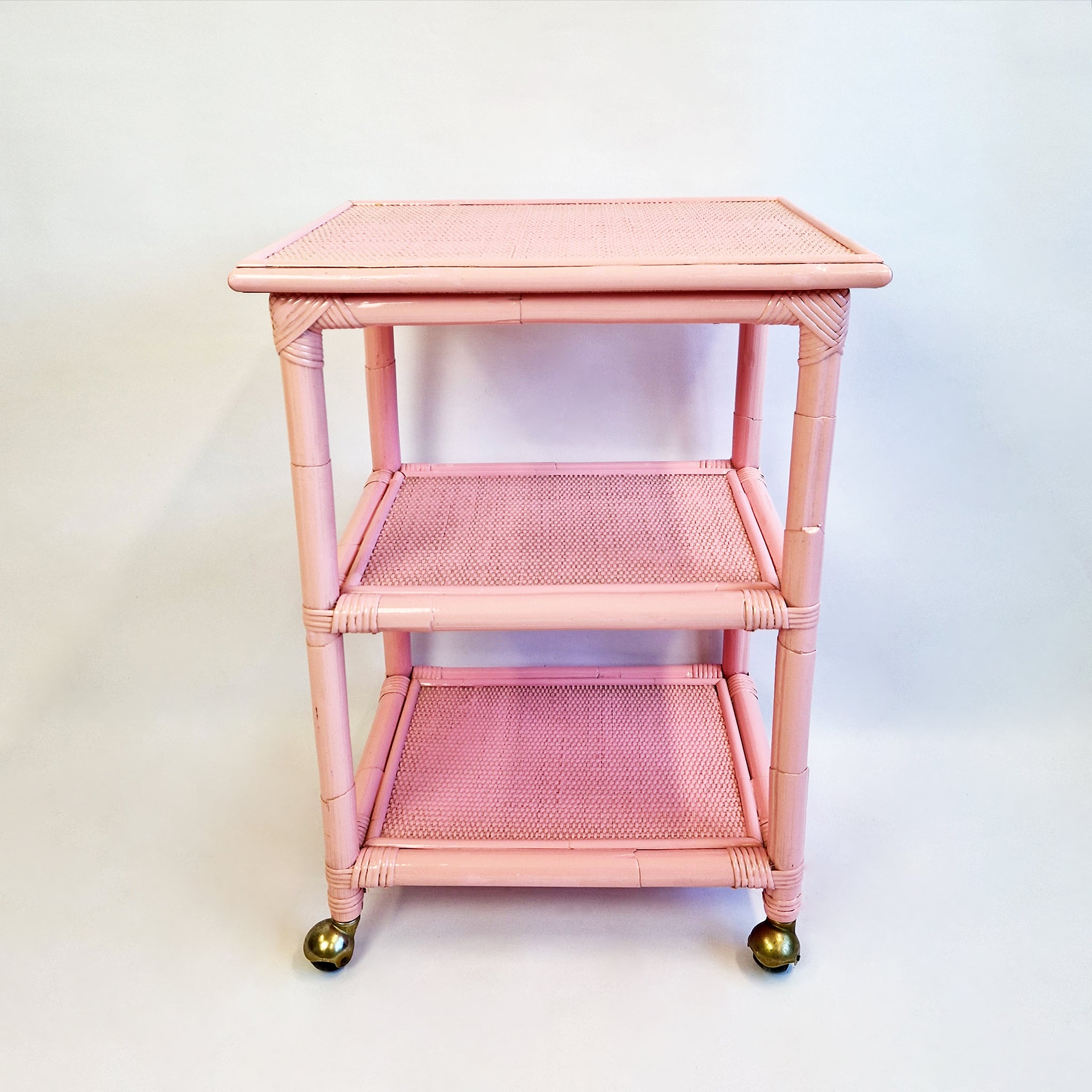 Vintage Italian side table with wheels in pink bamboo and rattan