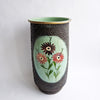 Vintage umbrella stand with flowers