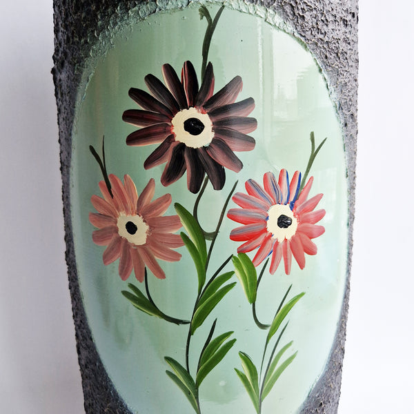 Vintage umbrella stand with flowers