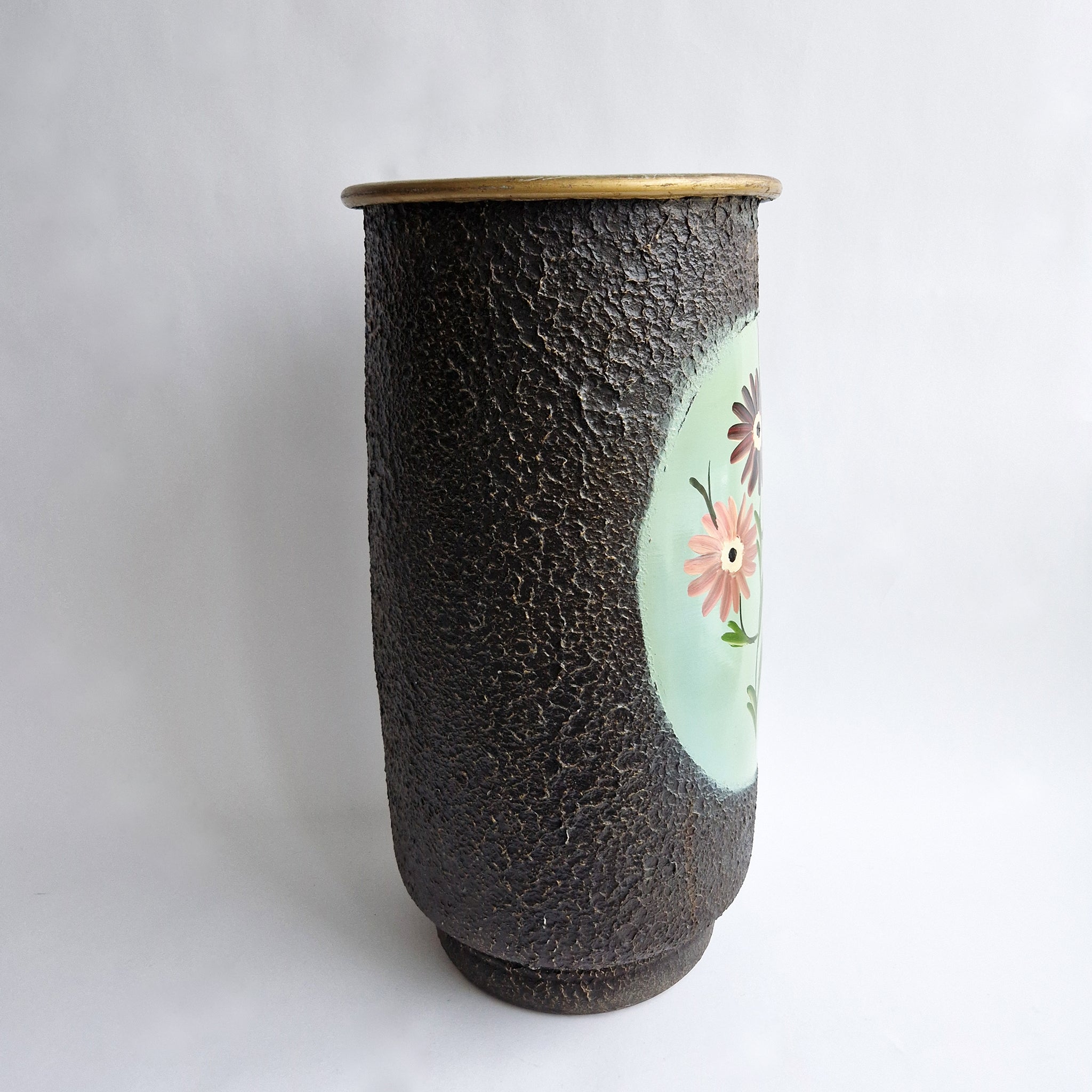 Vintage umbrella stand with flowers