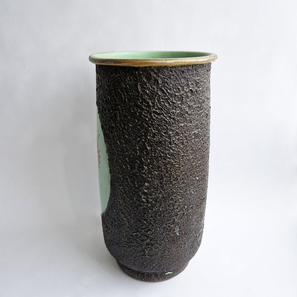 Vintage umbrella stand with flowers