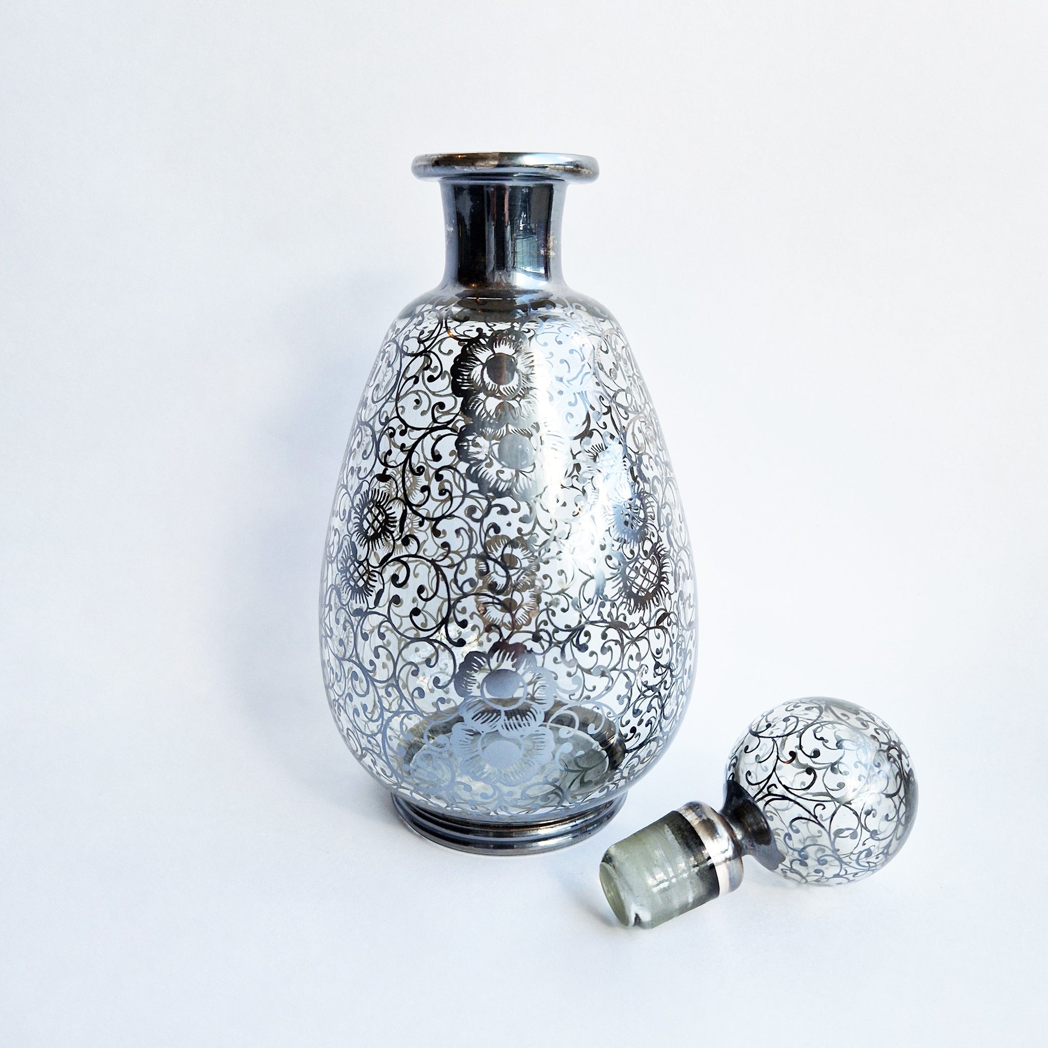 Vintage Venetian bottle with silver overlay