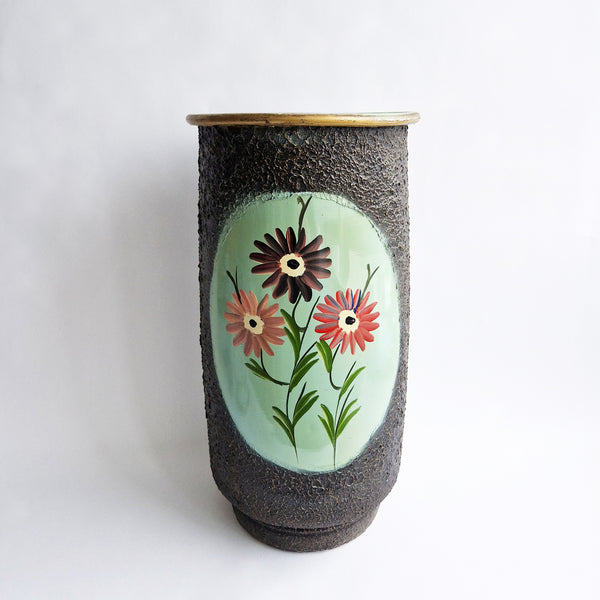 Vintage umbrella stand with flowers