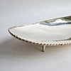 Vintage dish with scalloped edge and stiletto legs