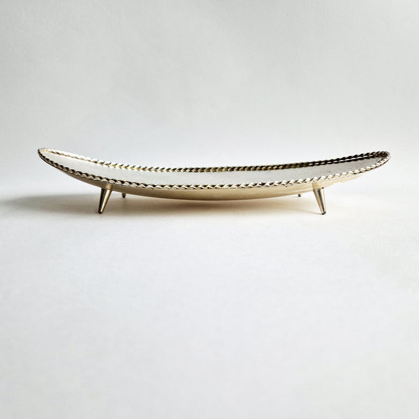 Vintage dish with scalloped edge and stiletto legs