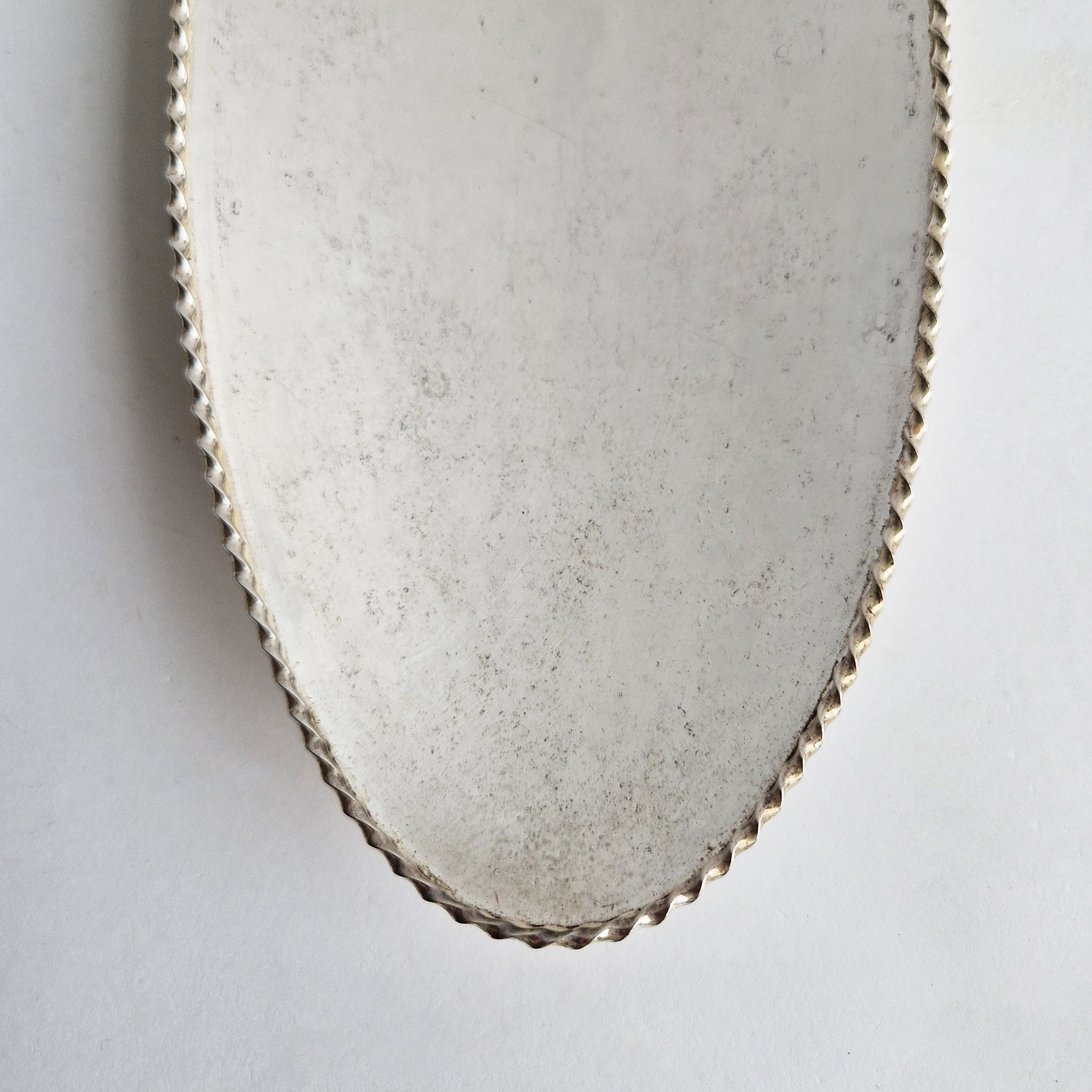 Vintage dish with scalloped edge and stiletto legs