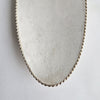 Vintage dish with scalloped edge and stiletto legs