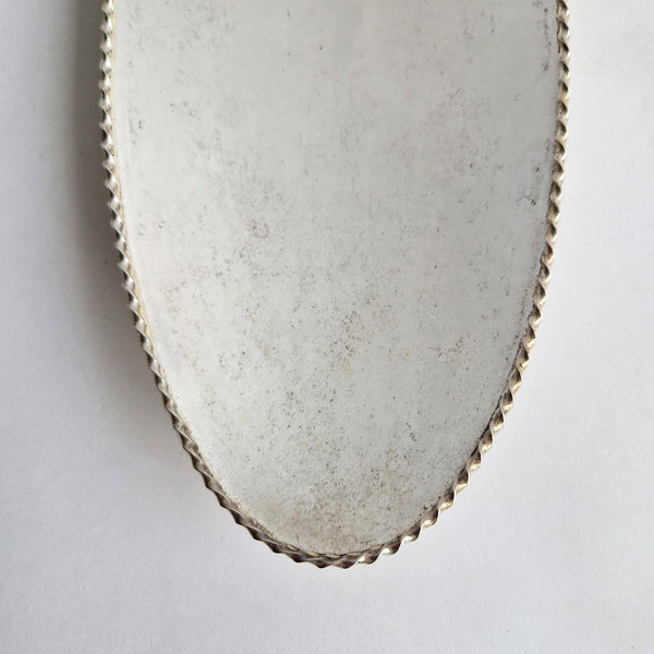 Vintage dish with scalloped edge and stiletto legs