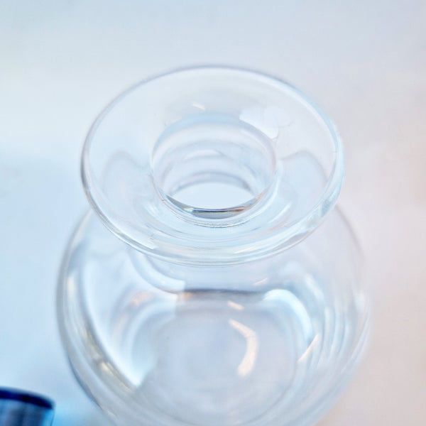 Vintage crystal decanter with blue stopper