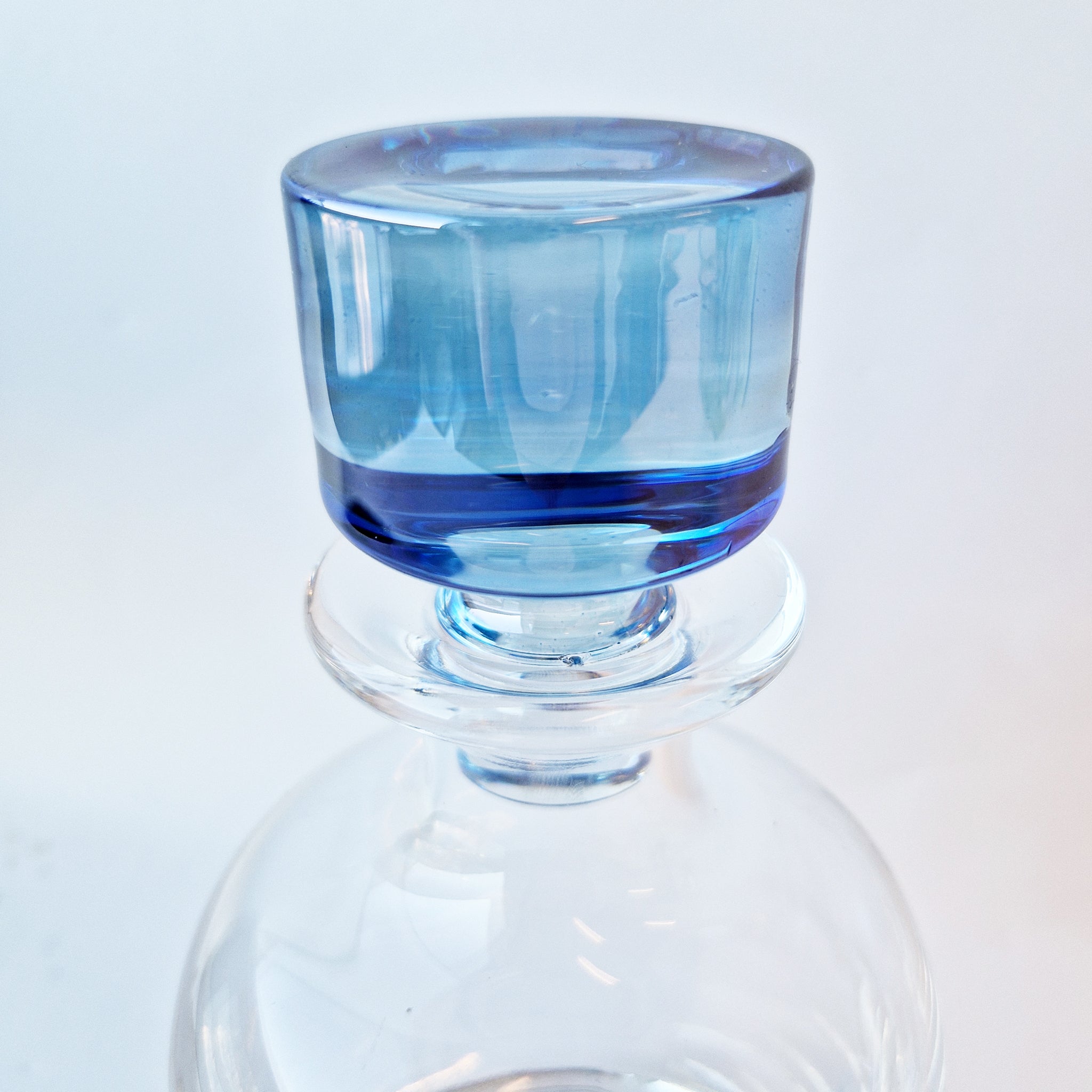 Vintage crystal decanter with blue stopper