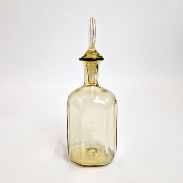 Hand-blown vintage glass bottle with stopper