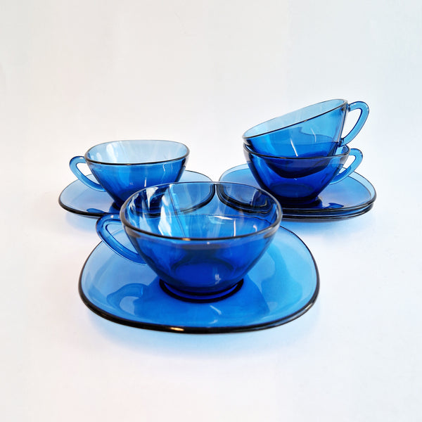 Vintage blue glass cups and saucers