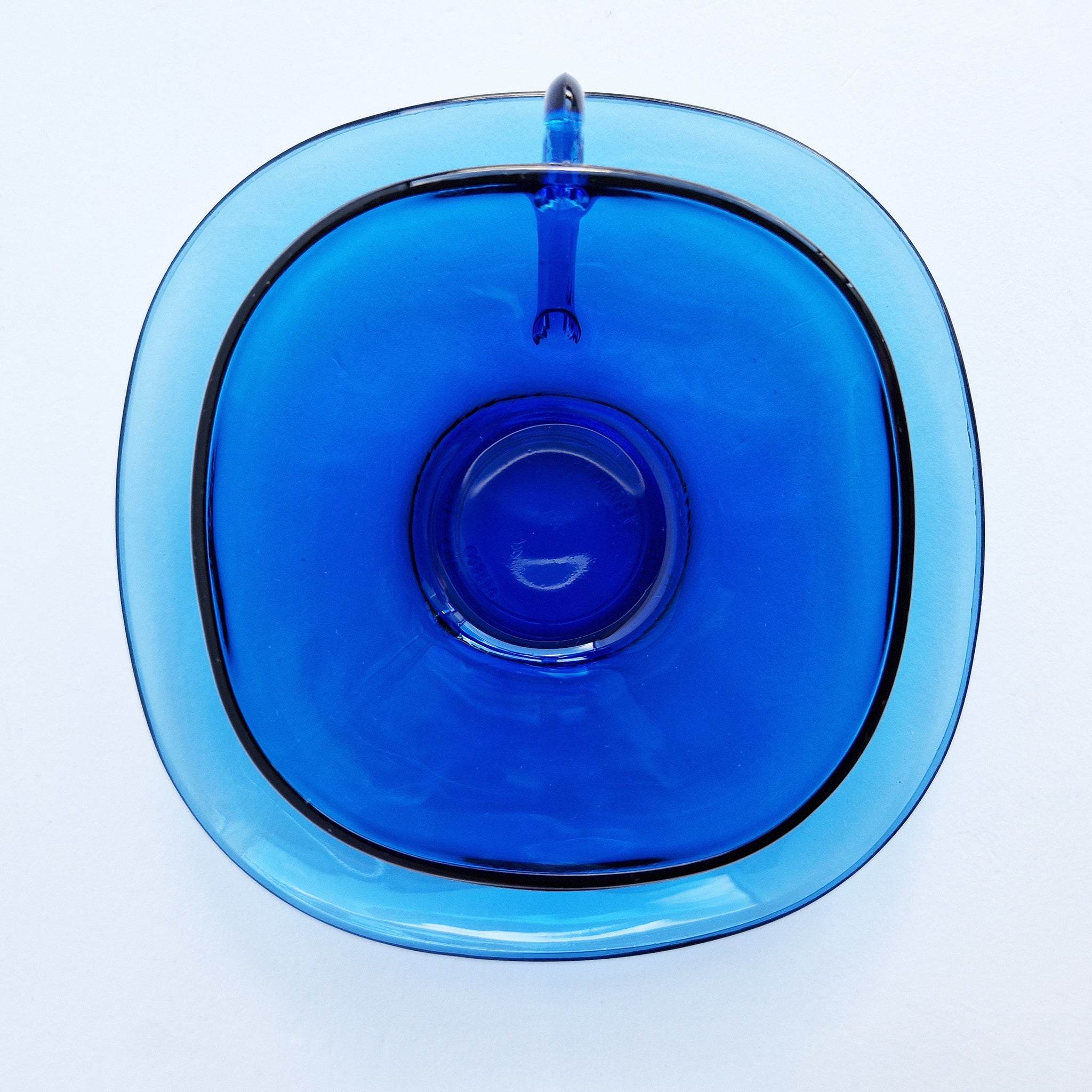 Vintage blue glass cups and saucers