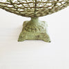 Vintage iron fruit basket on pedestal