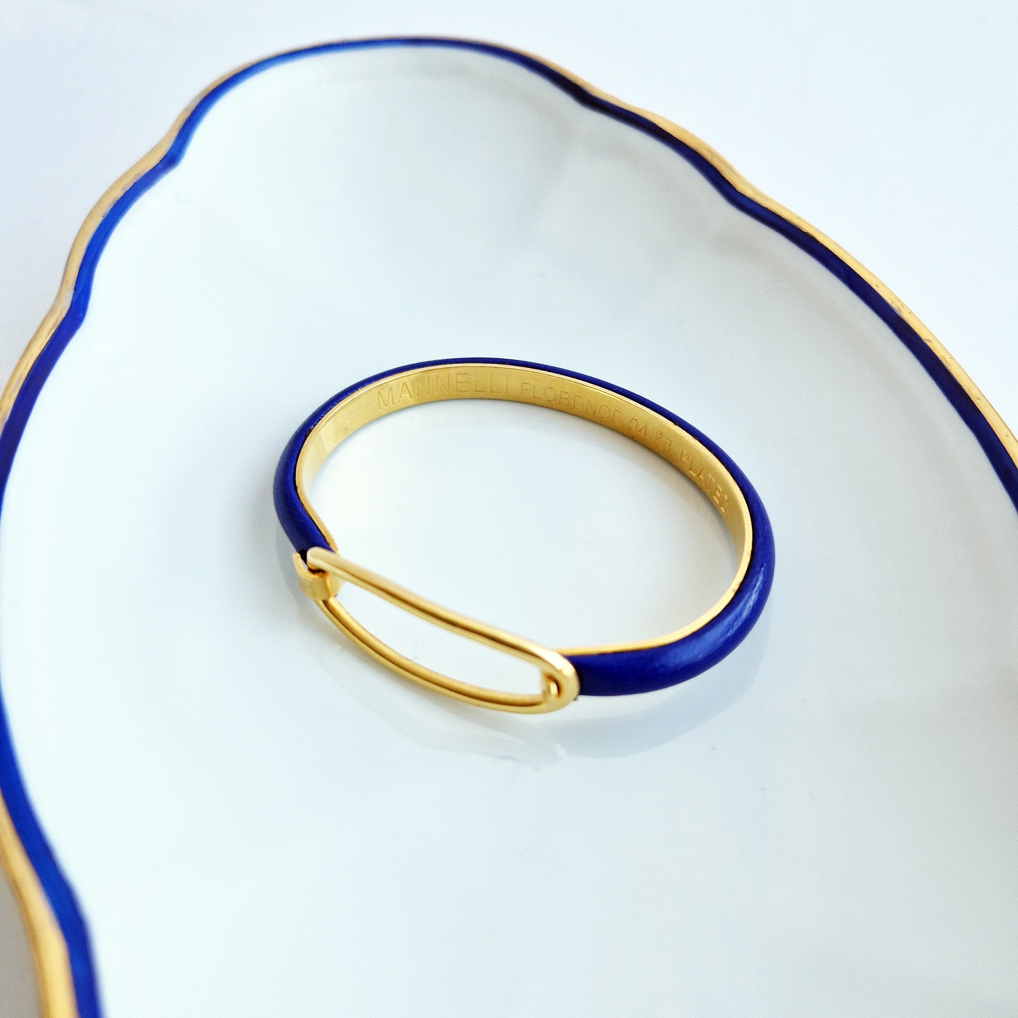 Pre-loved leather and gold bracelet by Mannelli