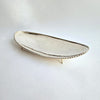 Vintage dish with scalloped edge and stiletto legs