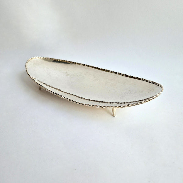 Vintage dish with scalloped edge and stiletto legs