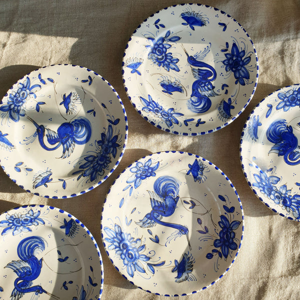 Mid-century plate with blue hand-painted decoration