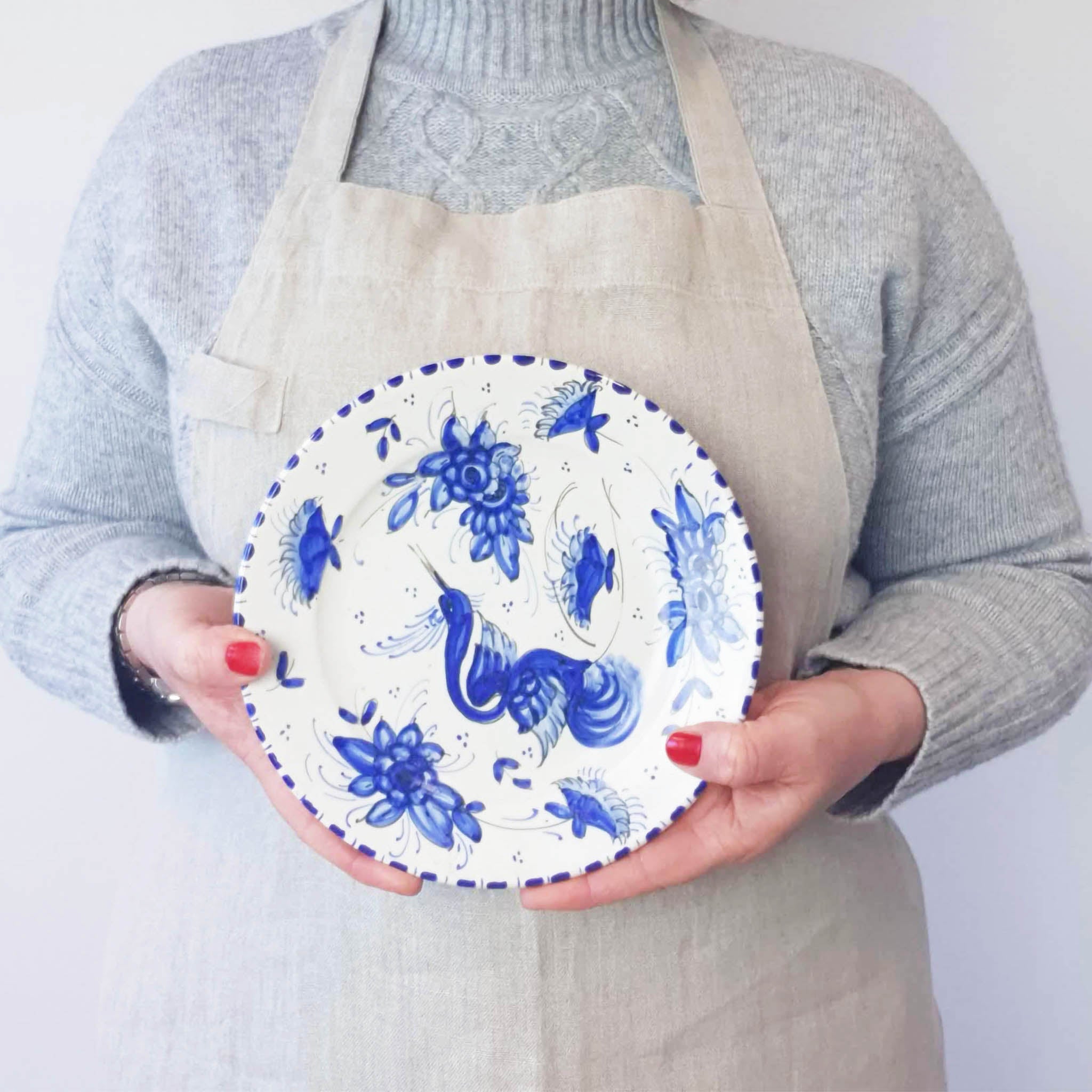 Mid-century plate with blue hand-painted decoration