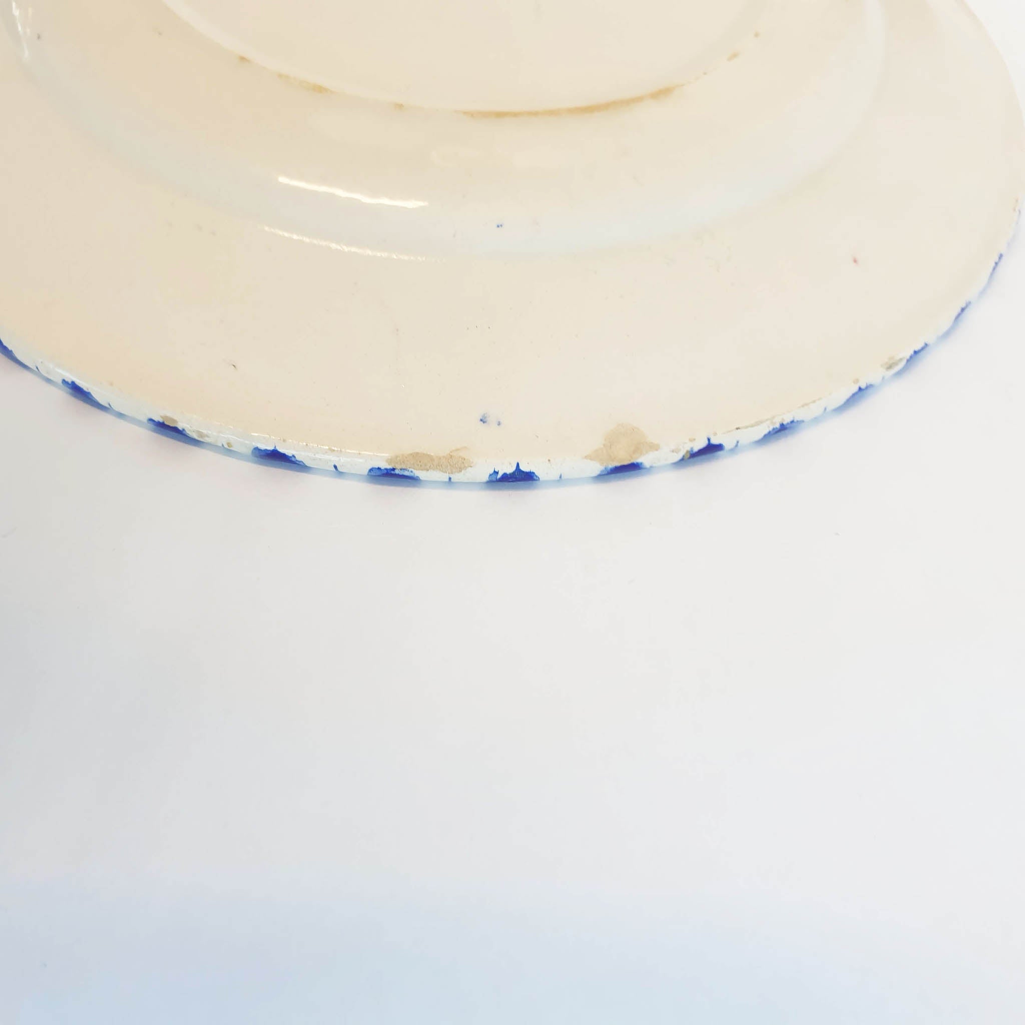 Mid-century plate with blue hand-painted decoration