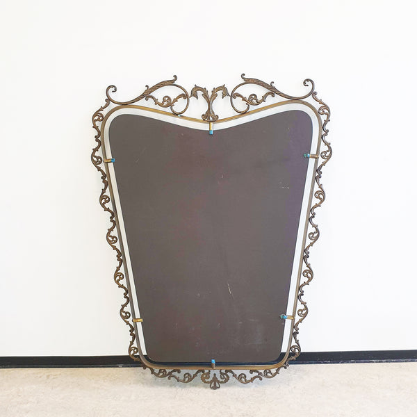 Mid-century Italian brass mirror with ornate frame