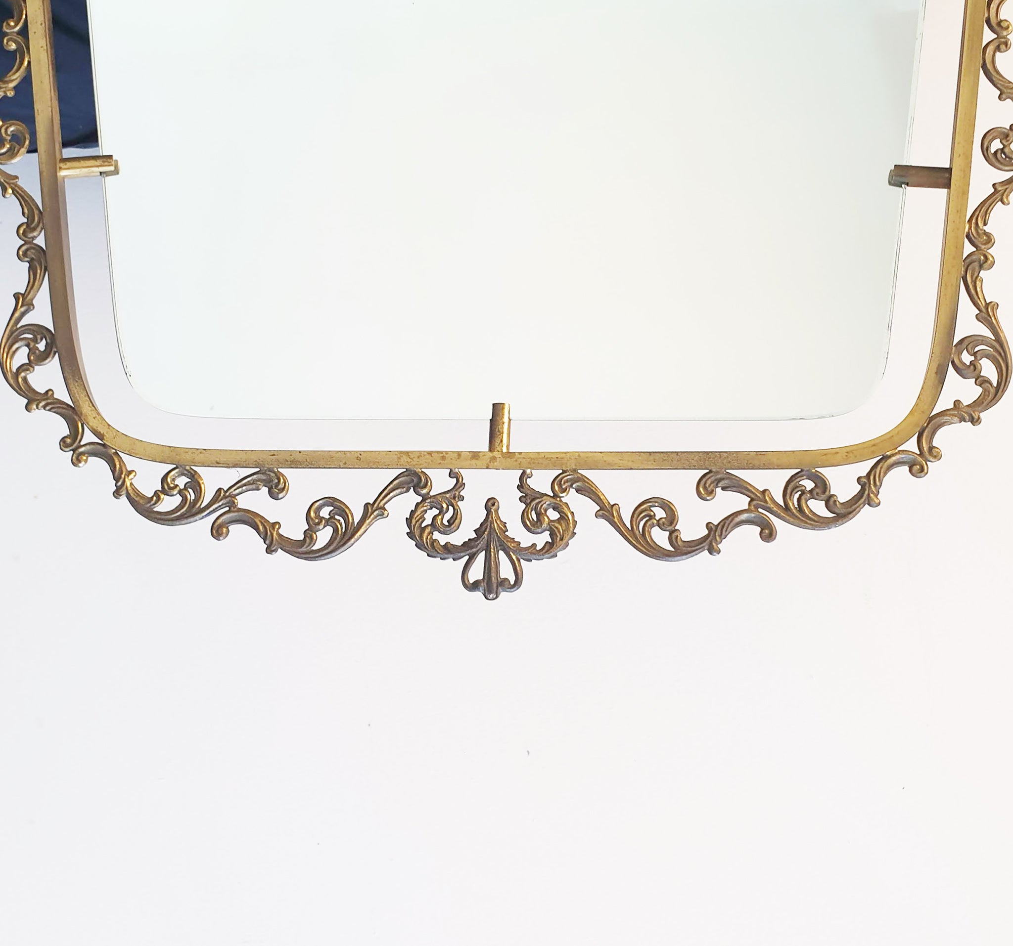 Mid-century Italian brass mirror with ornate frame