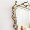 Mid-century Italian brass mirror with ornate frame