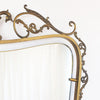 Mid-century Italian brass mirror with ornate frame