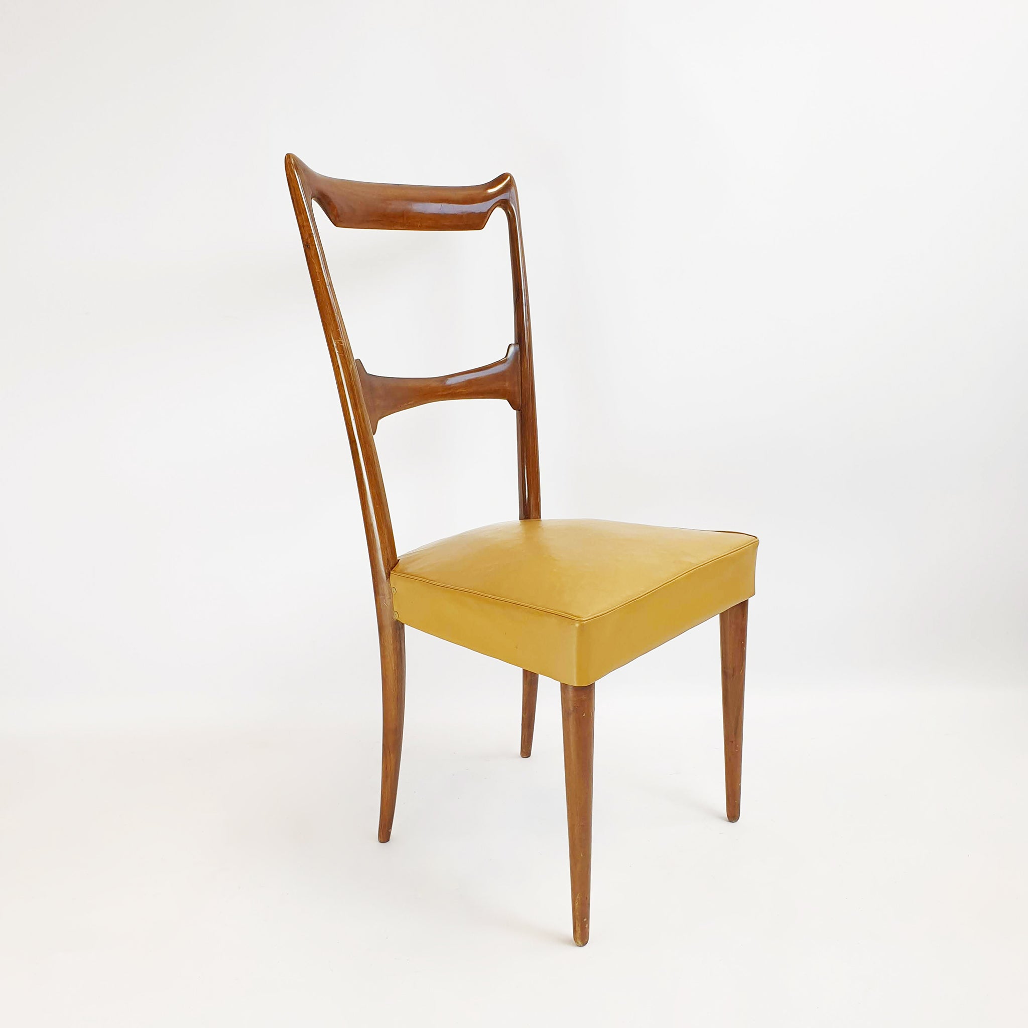 Six mid-century dining chairs in the style of Guglielmo Ulrich