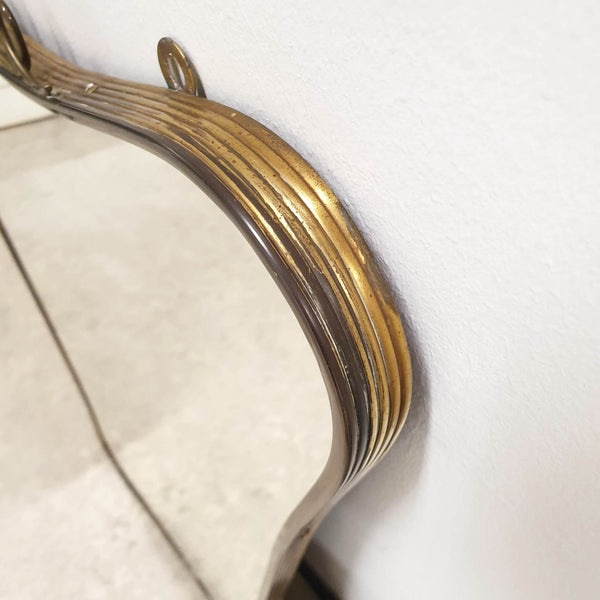 Mid-century Italian brass curvy mirror